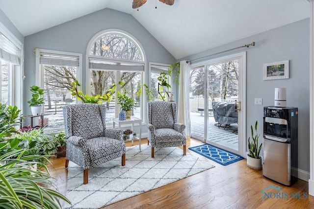 sunroom featuring ceiling fan and lofted ceiling