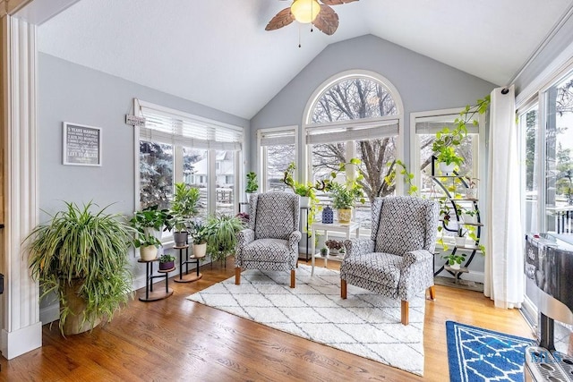 sunroom with lofted ceiling, plenty of natural light, and ceiling fan