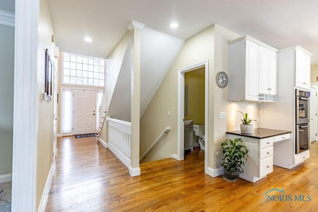 foyer entrance with plenty of natural light and light hardwood / wood-style floors