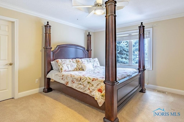 bedroom with ornamental molding, light colored carpet, and ceiling fan