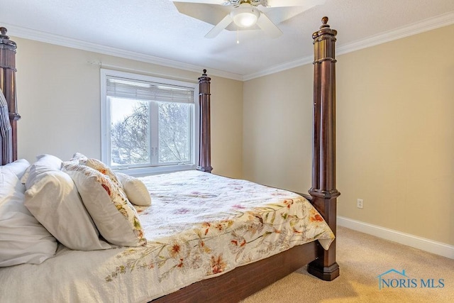 bedroom featuring crown molding, ceiling fan, and carpet flooring