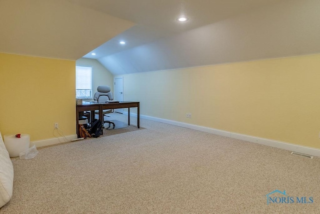 bonus room with vaulted ceiling and carpet