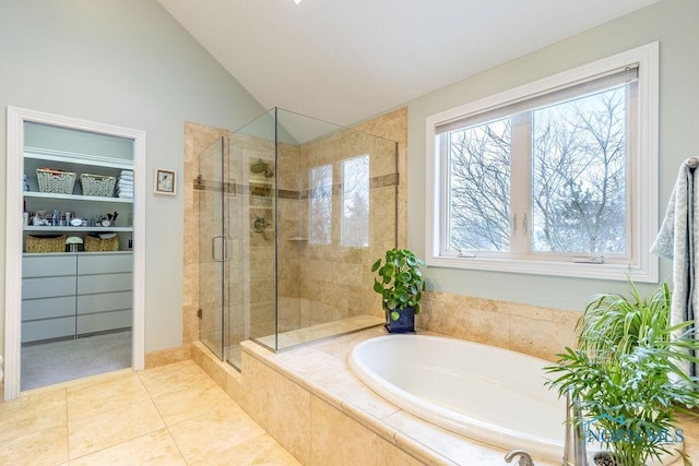 bathroom featuring tile patterned floors, lofted ceiling, and separate shower and tub