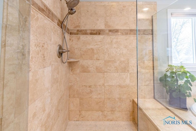 bathroom with tiled shower