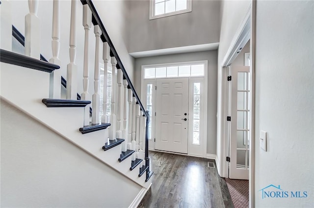 foyer with dark wood-type flooring