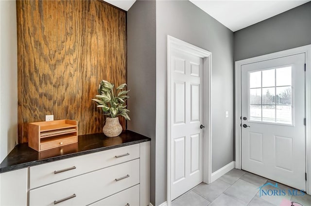 doorway to outside featuring light tile patterned floors