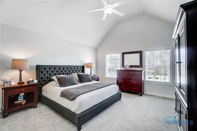 bedroom with light carpet, vaulted ceiling, and ceiling fan