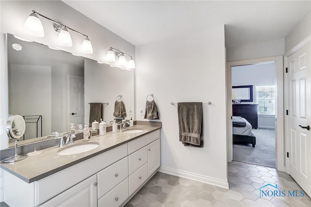 bathroom with tile patterned flooring and vanity