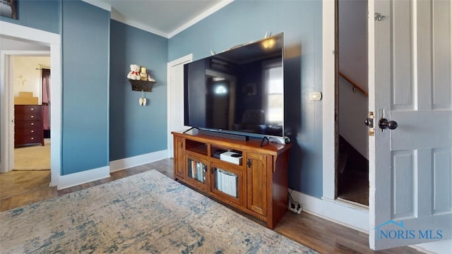 living room featuring ornamental molding and dark hardwood / wood-style flooring