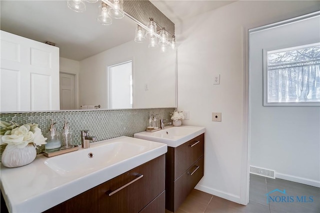 bathroom with vanity, tile patterned flooring, and decorative backsplash