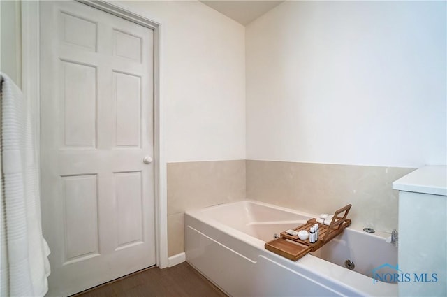 bathroom featuring a tub to relax in