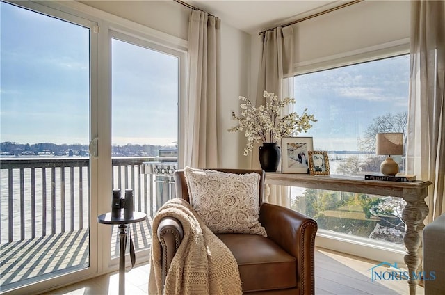 living area featuring a water view