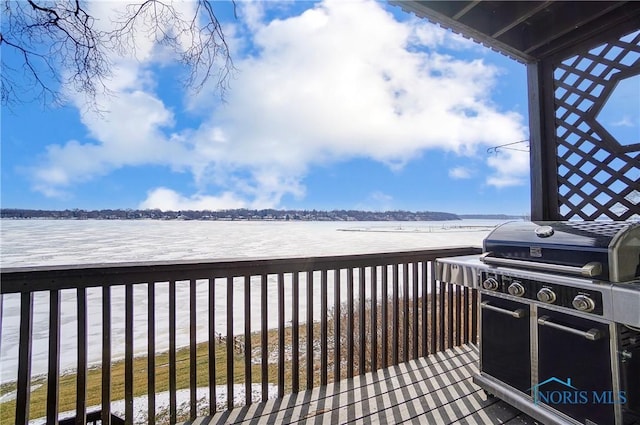 deck featuring a water view