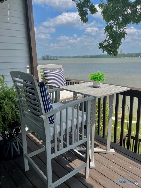 wooden deck with a water view