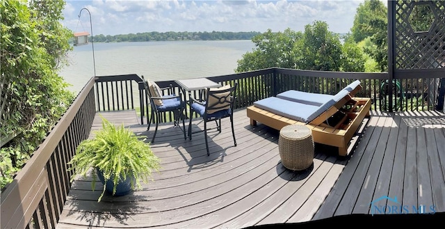 wooden terrace with a water view