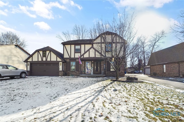 tudor home featuring a garage