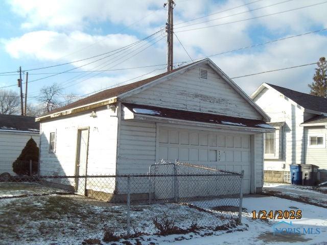 view of snow covered garage