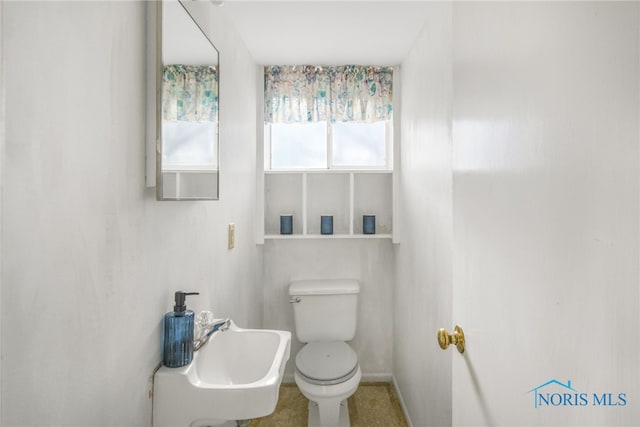 bathroom with sink and toilet