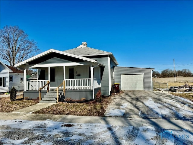 view of front of house with a garage and covered porch