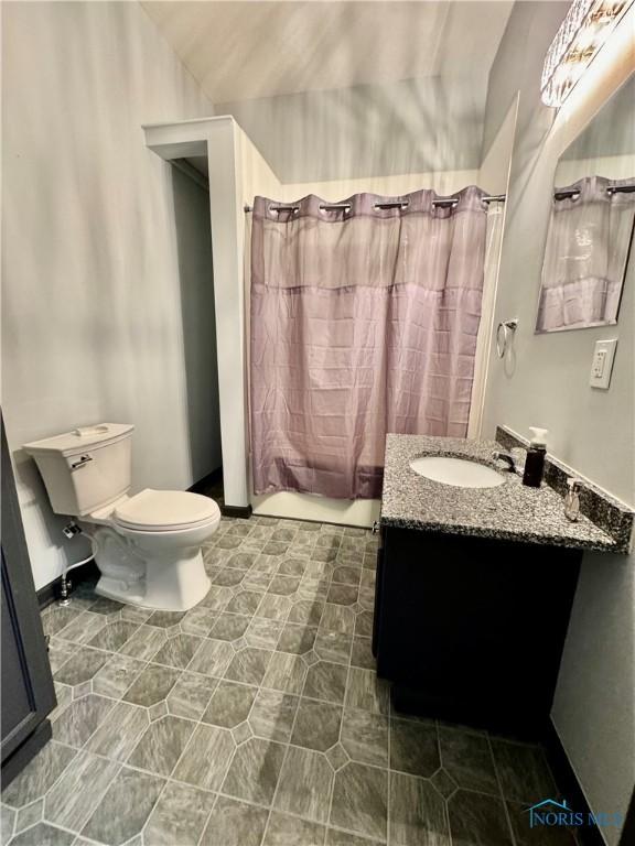 full bathroom featuring vanity, toilet, and shower / bath combo with shower curtain