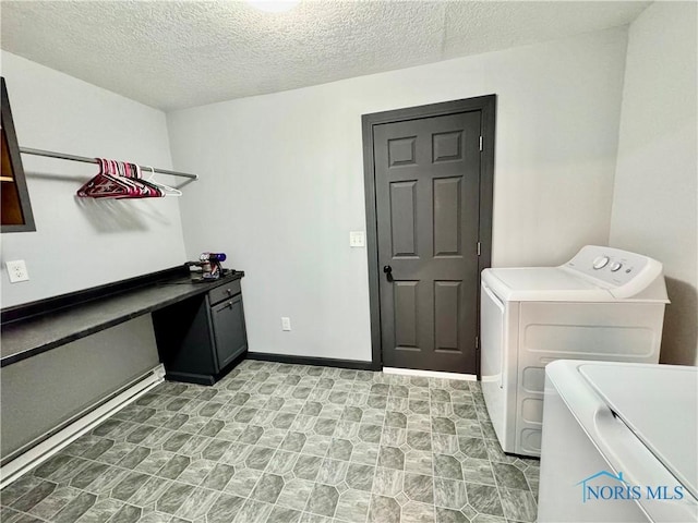 laundry room featuring separate washer and dryer, a textured ceiling, and baseboard heating