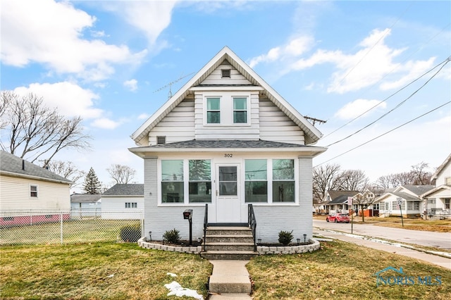 bungalow with a front lawn