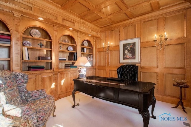 office space with wood ceiling, crown molding, wooden walls, light carpet, and built in shelves