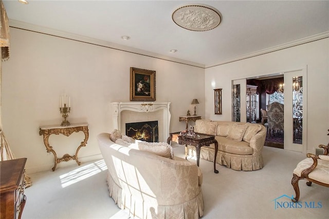 living room featuring ornamental molding and carpet floors