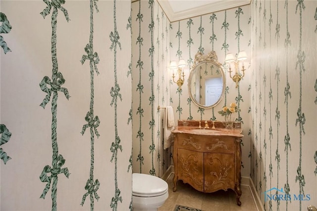 bathroom featuring vanity, tile patterned floors, and toilet