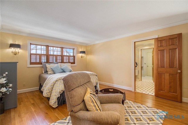 bedroom with crown molding and light hardwood / wood-style flooring