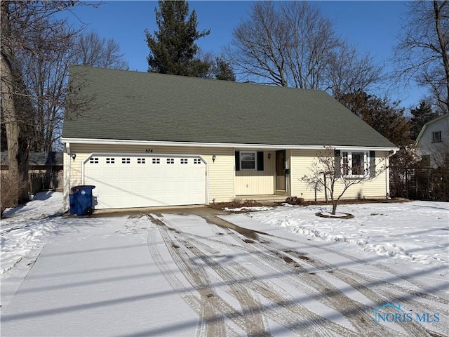 view of front of property featuring a garage