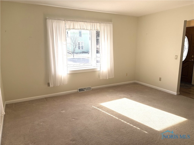 view of carpeted spare room