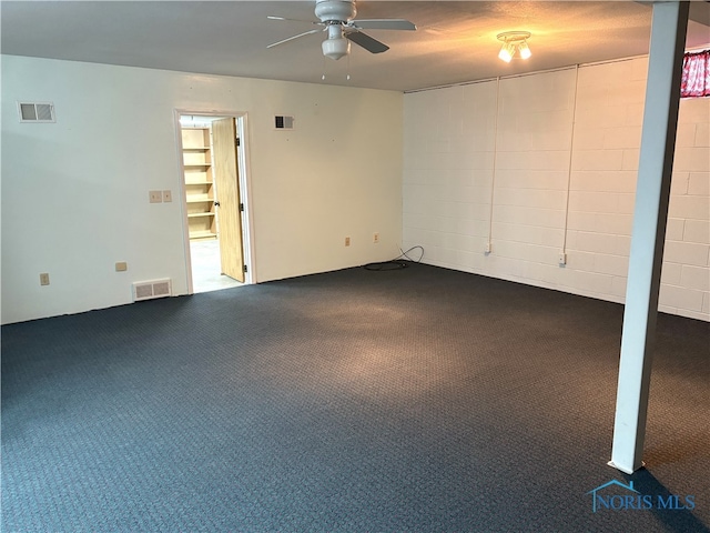 carpeted spare room featuring ceiling fan