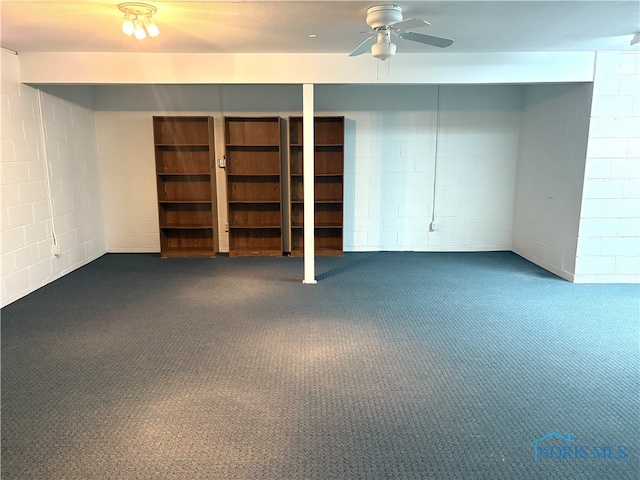 basement with carpet floors and ceiling fan