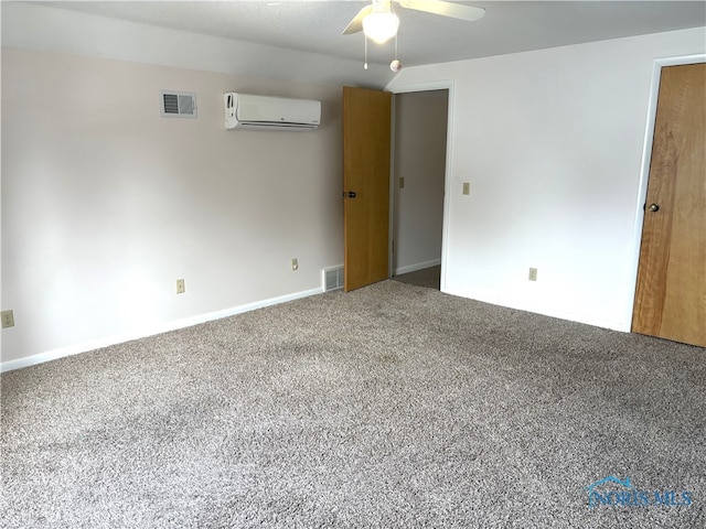 carpeted empty room featuring ceiling fan and an AC wall unit