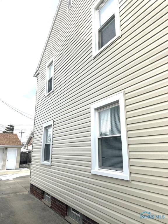 view of side of property featuring a patio