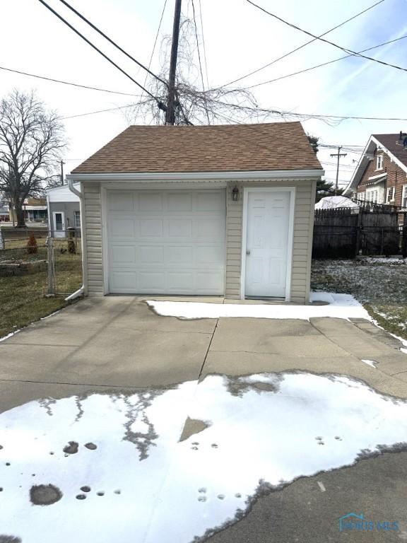 view of snow covered garage