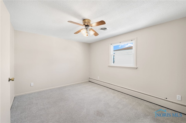 carpeted empty room featuring ceiling fan, a baseboard heating unit, and a textured ceiling