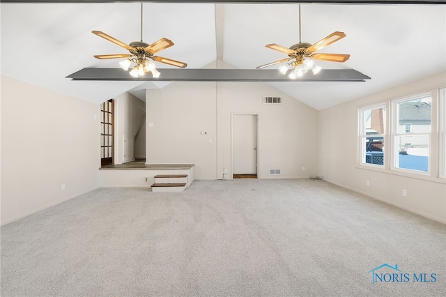 unfurnished living room with light carpet, vaulted ceiling, and ceiling fan