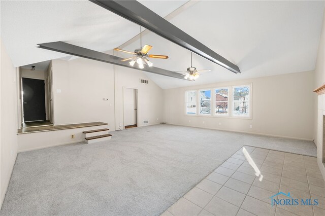 unfurnished living room featuring beamed ceiling, light colored carpet, ceiling fan, and high vaulted ceiling