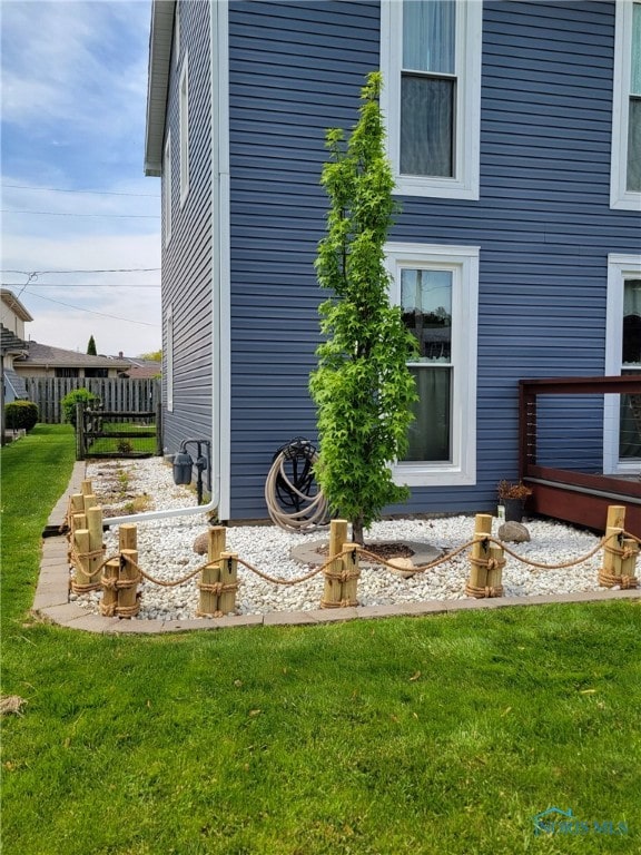 view of home's exterior with a lawn