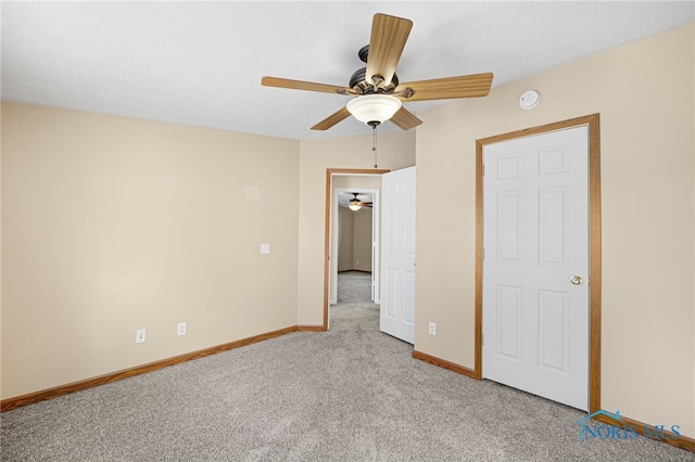 unfurnished bedroom with ceiling fan and carpet flooring