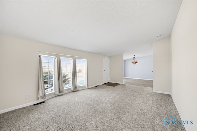 unfurnished room with carpet floors