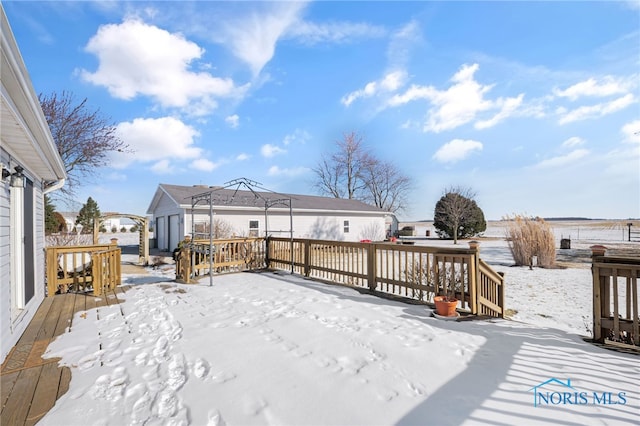 snow covered deck featuring a gazebo