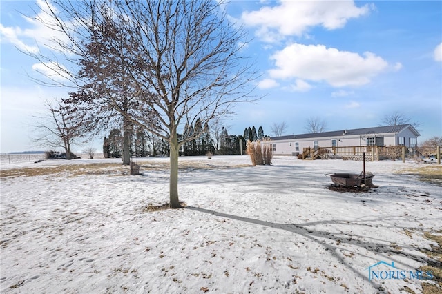 view of yard layered in snow