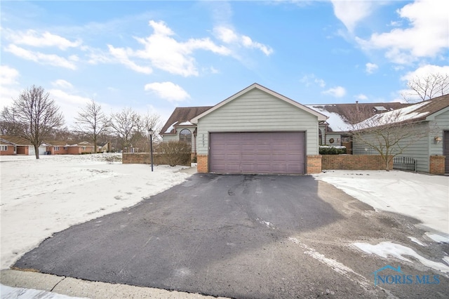 view of snow covered garage