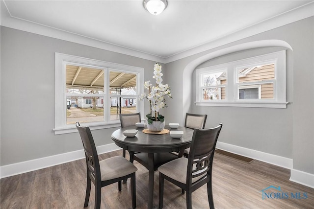 dining area with wood-type flooring