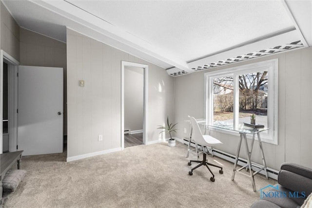 carpeted office with baseboard heating and vaulted ceiling