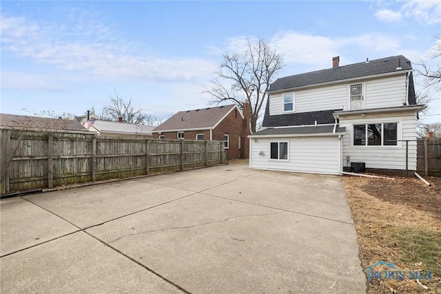 rear view of property featuring a patio area