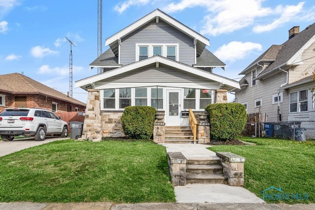 bungalow with a front yard